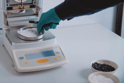 Weighing the components of the explosive on electronic scales.