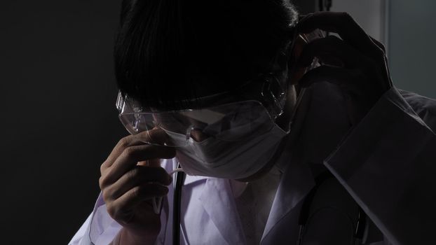 Doctor wearing protection face mask against coronavirus before work night ward in hospital. medical stuff preventive gear. Woman wearing an anti virus protective medical mask to prevent  COVID-19 outbreak