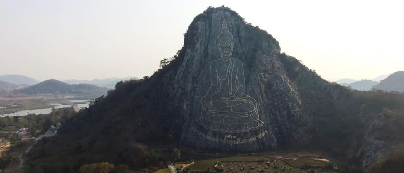Buddha painted on a rock. A Giant Buddha drawing.