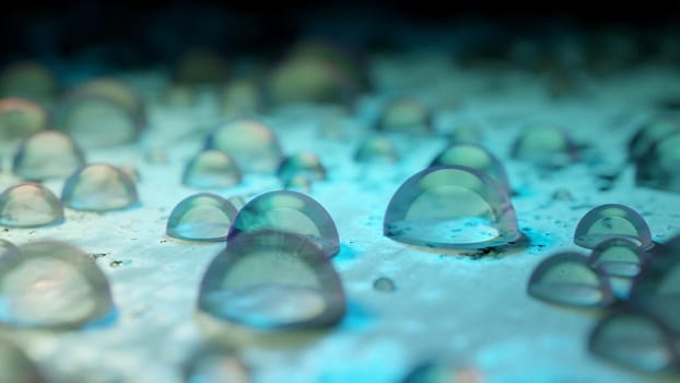 Shiny clear droplets on a reough aquamarine surface, extreme close up. Abstract concept background. Digital 3D render.