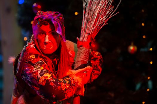 Creepy Baba Yaga in red lighting.