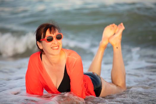 Happy woman at the sea..Portrait of a senior woman bathing in the sea