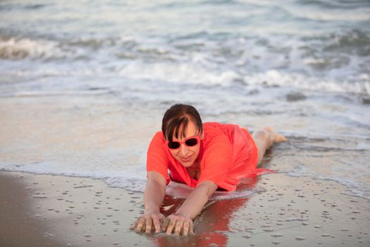 Happy woman at the sea..Portrait of a senior woman bathing in the sea