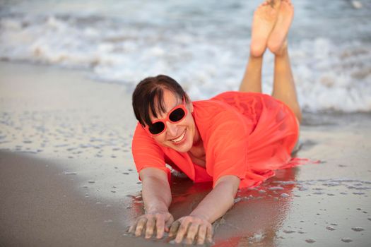 Happy woman at the sea..Portrait of a senior woman bathing in the sea