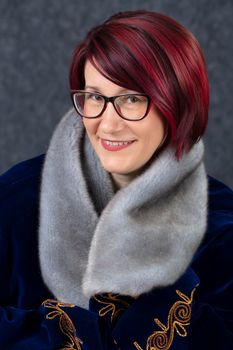 Portrait of a happy middle aged woman with glasses