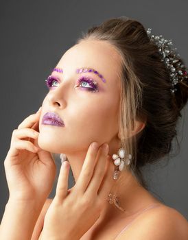 Portrait of a young beautiful girl model with bright makeup.Winter make-up.