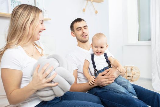 Family isolated at home. Mom dad and little child.