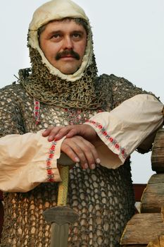 A man in the clothes of a medieval knight.