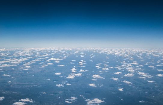 Above the clouds. White clouds. Sea of clouds. Small clouds.