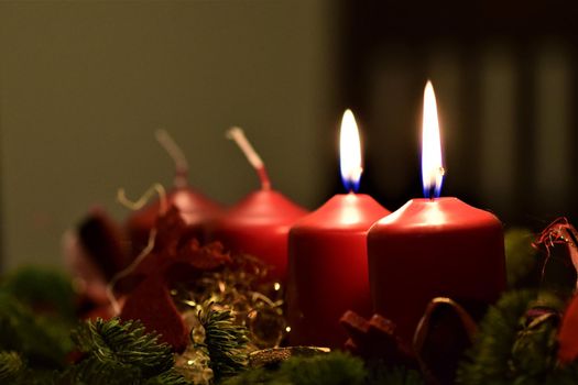 close-up of an Advent arrangement with 2 burning candles