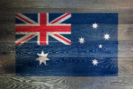An Australia flag on rustic old wood surface background