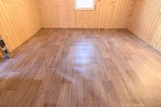 Linoleum laid on the floor in a small room of a country house