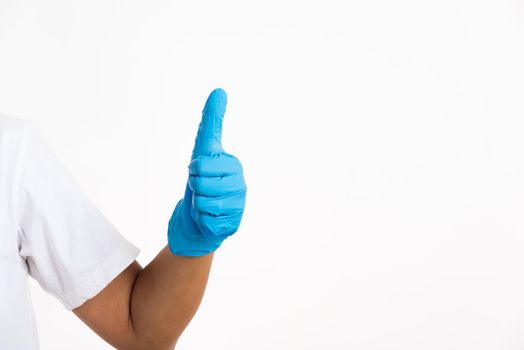 Woman wearing and putting hand to blue rubber latex glove for doctor with thumb up sign gesturing, studio shot isolated on white background, Hospital medical safety concept