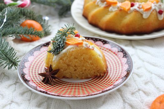 A slice of Christmas cake decorated with tangerine slices.Texture or background