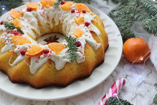 Homemade Christmas pastries decorated with a slice of tangerine and a pine twig