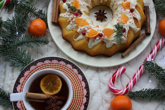 New year's cupcake with tea and cinnamon on the table.Texture or background