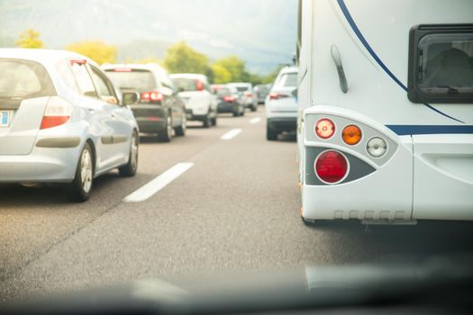 Cars on a highway, traffic jam in summer season