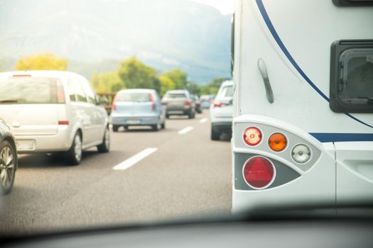 Cars on a highway, traffic jam in summer season