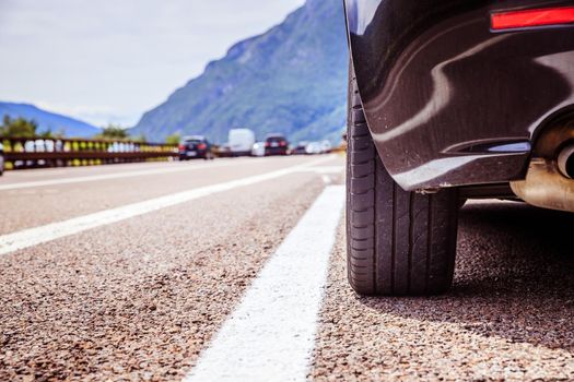 Close up of a car standing on a breakdown lane, summer vacation