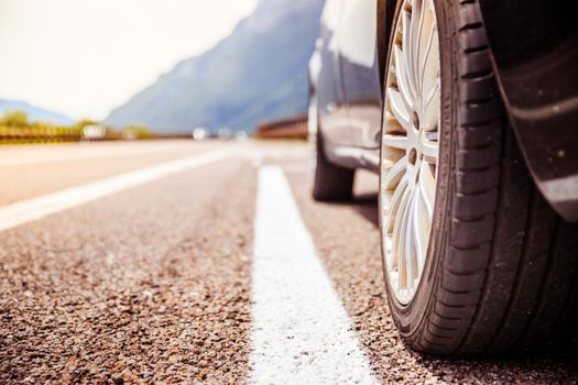 Close up of a car standing on a breakdown lane, summer vacation