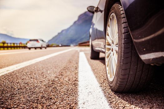 Close up of a car standing on a breakdown lane, summer vacation