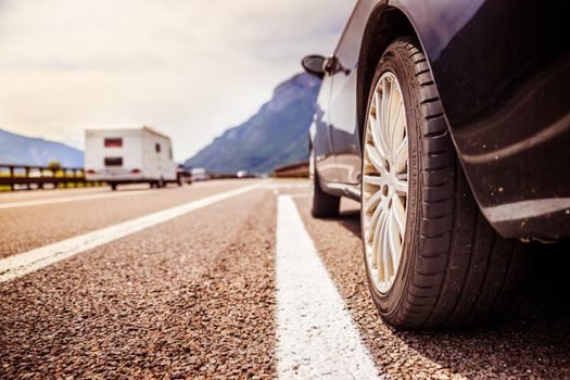 Close up of a car standing on a breakdown lane, summer vacation