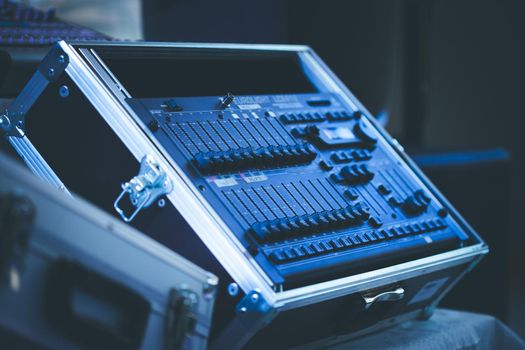 Professional music production in a sound recording studio, mixer desk