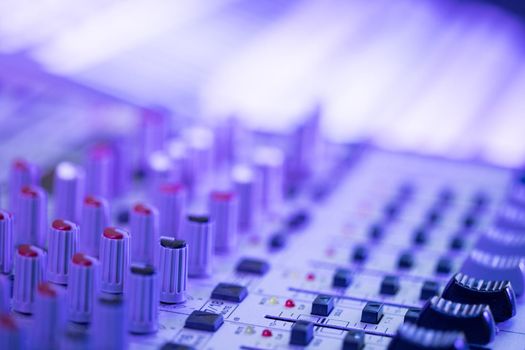 Professional music production in a sound recording studio, mixer desk