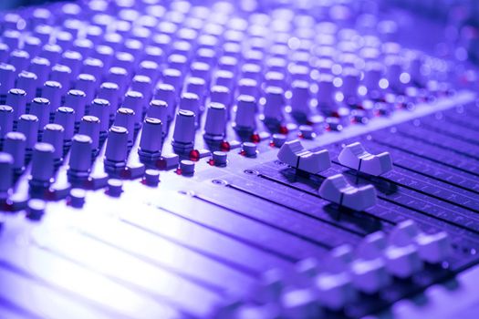 Professional music production in a sound recording studio, mixer desk