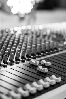 Professional music production in a sound recording studio, mixer desk