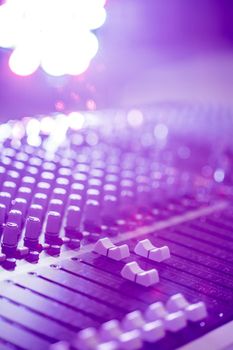 Professional music production in a sound recording studio, mixer desk