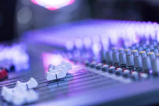 Professional music production in a sound recording studio, mixer desk