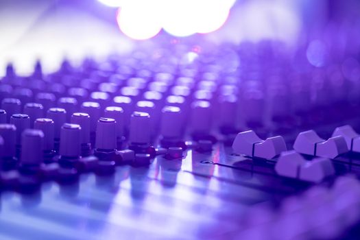 Professional music production in a sound recording studio, mixer desk