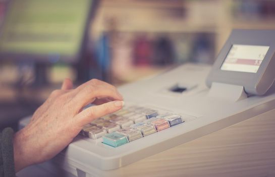 Cash register in a shop: Customer is paying purchase