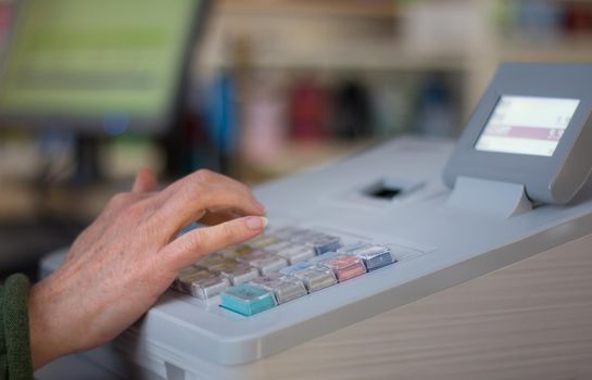 Cash register in a shop: Customer is paying purchase