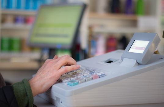 Cash register in a shop: Customer is paying purchase