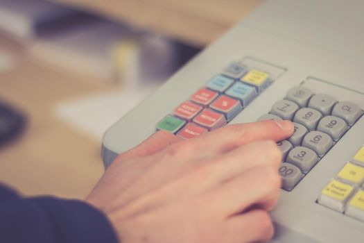 Cash register in a shop: Customer is paying purchase