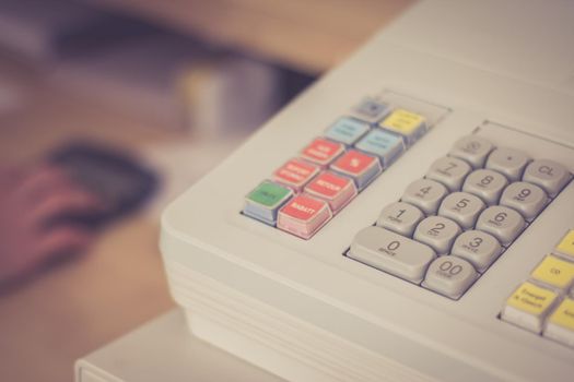 Cash register in a shop: Customer is paying purchase