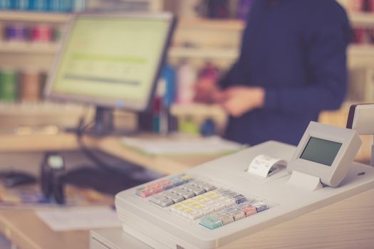 Cash register in a shop: Customer is paying purchase