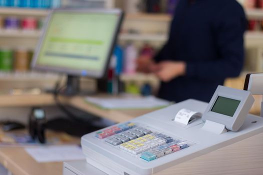 Cash register in a shop: Customer is paying purchase