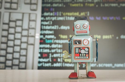 Symbol for a chatbot or social bot and algorithms, program code in the background