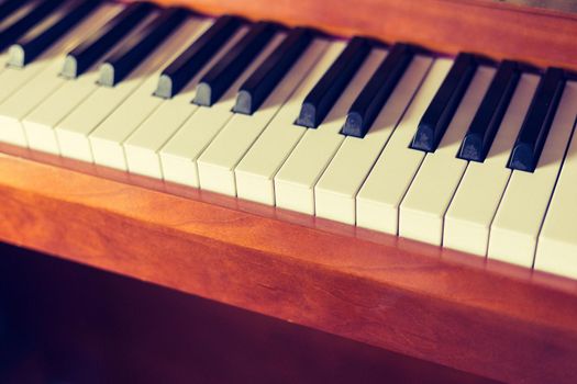 Rustic piano keys, close up picture. Classical instrument.