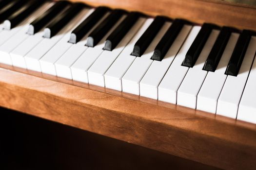 Rustic piano keys, close up picture. Classical instrument.