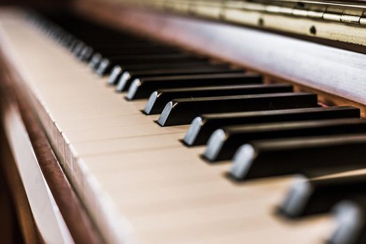Rustic piano keys, close up picture. Classical instrument.