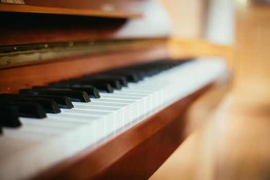 Rustic piano keys, close up picture. Classical instrument.