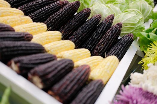 corn vegetable flower fruit on shelf at market. agriculture produce for sale