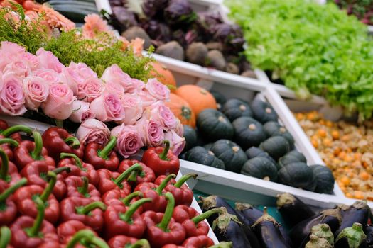 rose flower vegetable on shelf at market. agriculture produce for sale