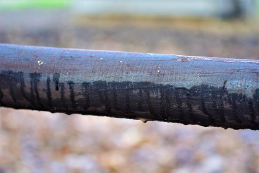 Close up of a pasture fence made of wooden slats