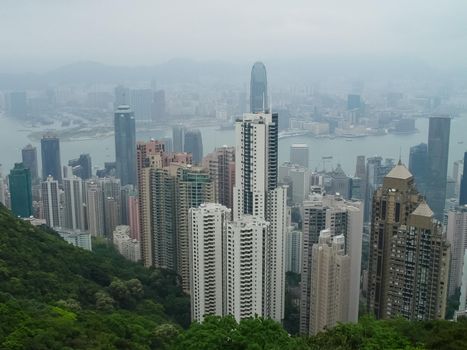 Skyscrapers of Hong Kong. The cityscape through a haze of smog over the city.