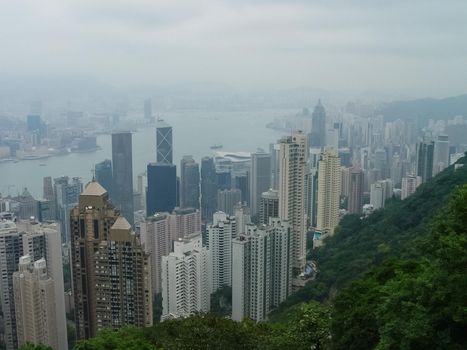 Skyscrapers of Hong Kong. The cityscape through a haze of smog over the city.